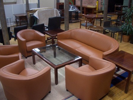 reception area set with club chairs, table and a couch