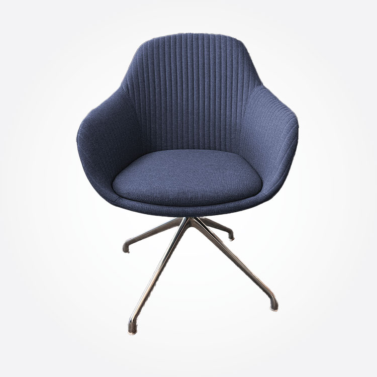 Dark blue, modern, upholstered chair with curved backrest and seat, supported by a four-legged metal base, against a plain white background.