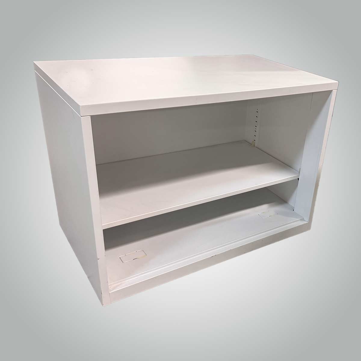 A minimalist white wooden shelf with two tiers against a light gray background. The clean design conveys simplicity and modern style.