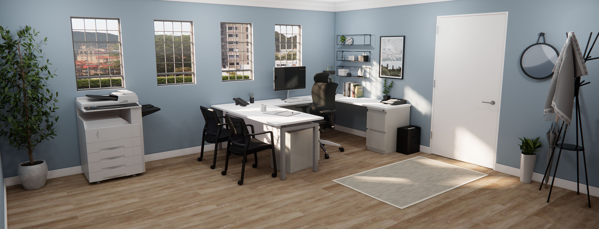 A modern office with light blue walls and hardwood floors. Features include two desks with computers, chairs, a printer, and large windows with city views.
