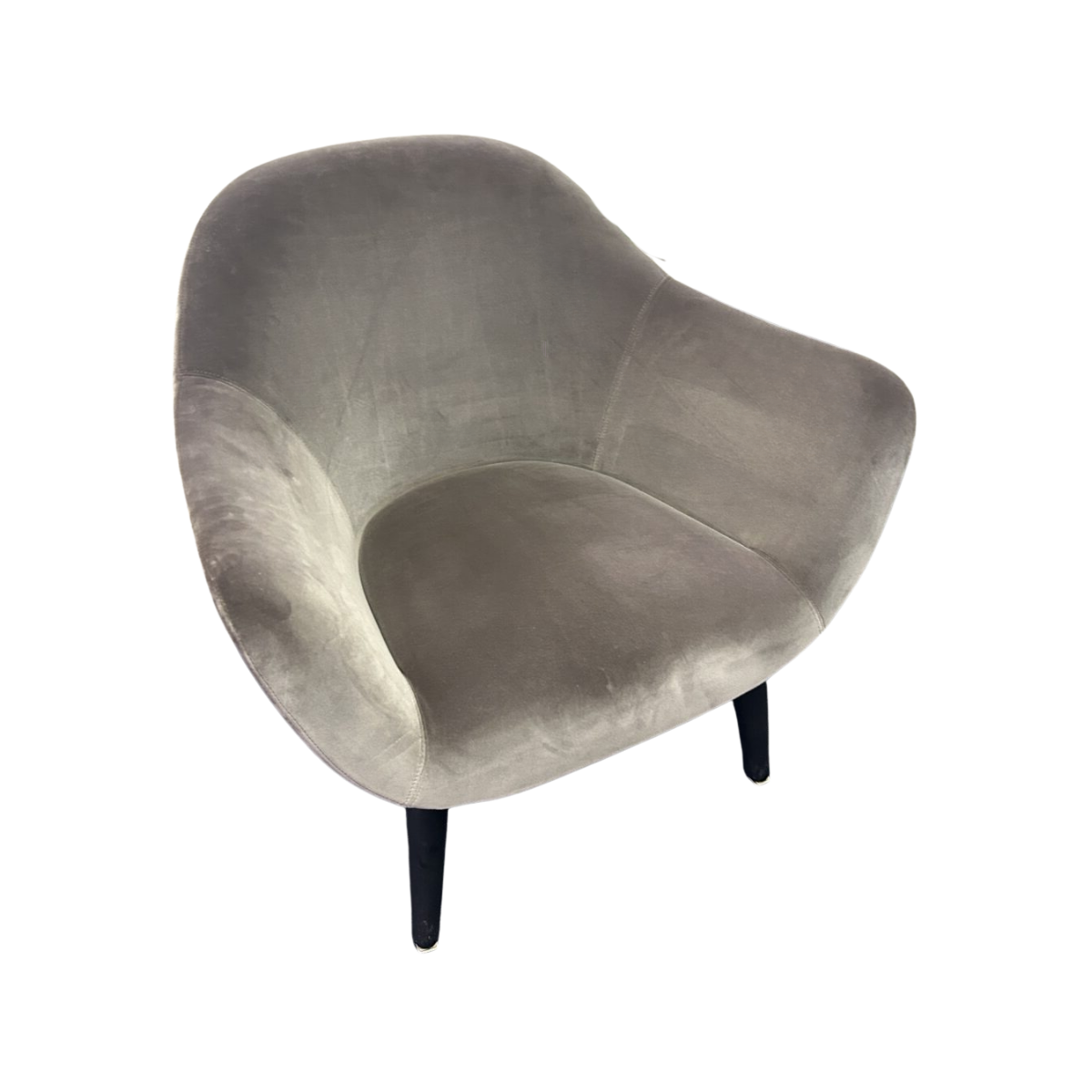 Cozy, light gray velvet chair with sleek, curved design and sturdy black legs. The chair exudes comfort and modern elegance.