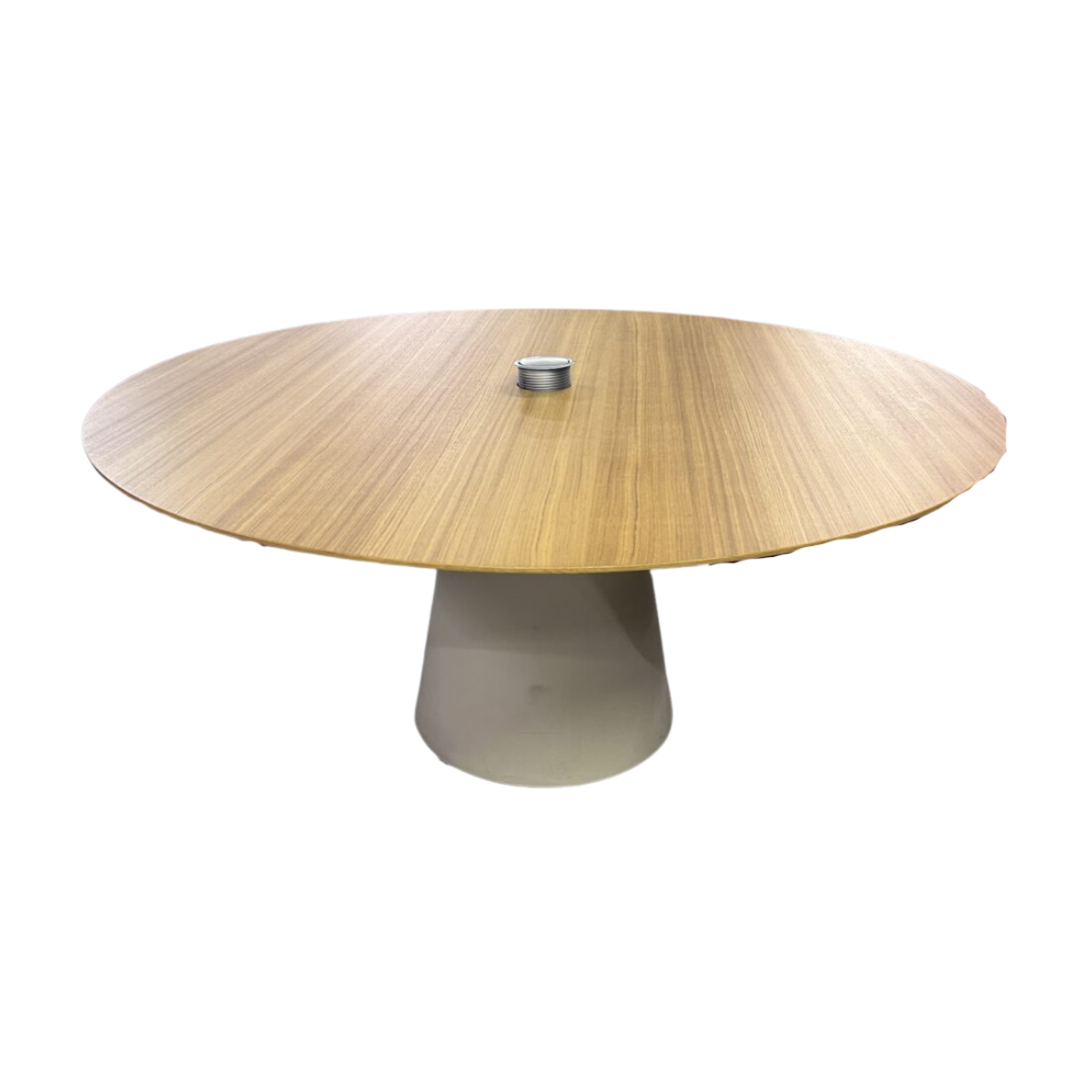 A round wooden table with a central cylindrical base and a small metallic cup on top. The table's smooth, light brown surface is minimalistic and modern.