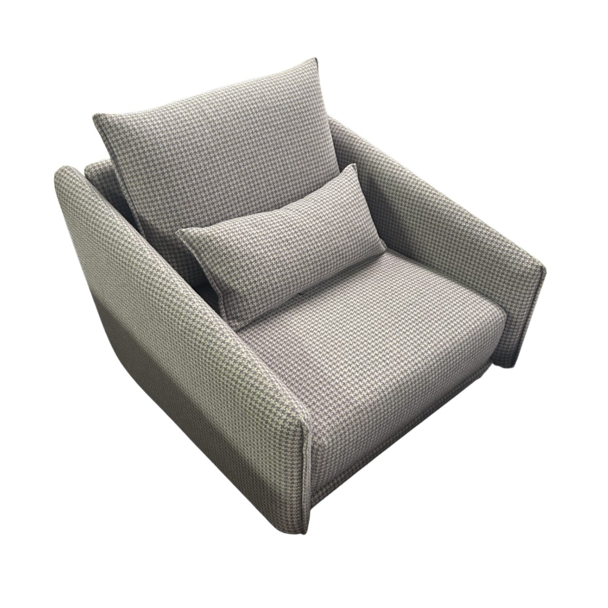 A gray houndstooth-patterned armchair with plush cushions, seen from above. It exudes a cozy, inviting atmosphere ideal for relaxing.