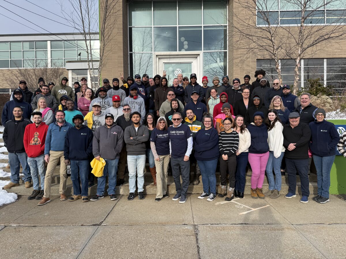 Conklin Office Furniture employees pose for a photo outside the company's headquarters in Holyoke, Massachusetts.