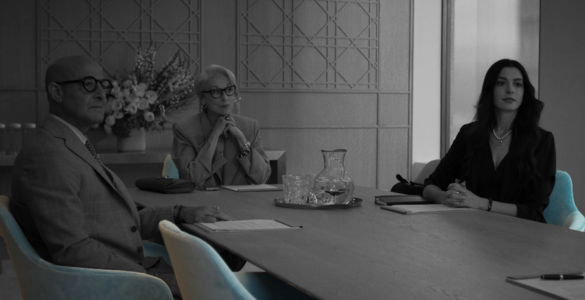 Conference room scene from The Devil Wears Prada 2 trailer featuring pre-owned Herman Miller Saiba chairs around a large meeting table during a corporate discussion.